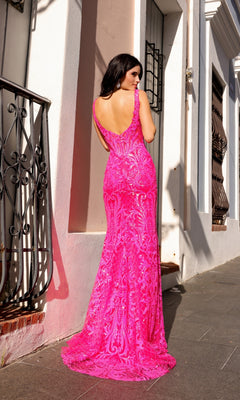 A woman stands on a sidewalk facing away from the camera, wearing the Deep V-Neck Long Sequin-Print Prom Dress E1274 in bright pink with an intricate lace pattern and backless design.