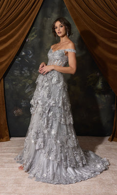 Eureka EK102 off-the-shoulder floor-length gown in silver, featuring a tiered, ruffled skirt with intricate floral embroidery.