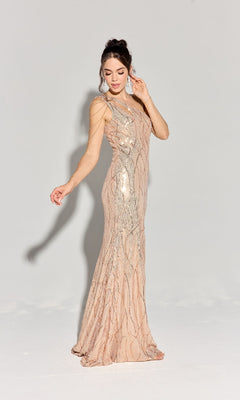 Woman poses in a studio against a plain background, wearing the Eureka EK113 One-Shoulder Long Sequin Prom Dress—a floor-length, sleeveless gown in light pink covered in sequins, with one arm raised and the other extended.