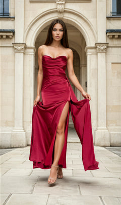A woman wearing the Strapless Long Satin Prom Dress: Eureka EK118 with a thigh-high slit in a Parisian background. 