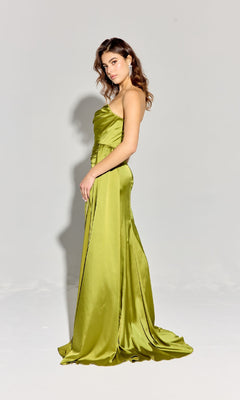 A woman stands in profile wearing the Eureka EK118 Strapless Long Satin Prom Dress in lime green, shown floor-length against a plain light gray background.