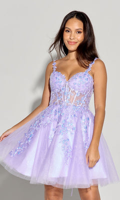 A woman models the Eureka EK152 Short Fit-and-Flare Lace Hoco Dress, featuring lavender floral appliqué and thin straps, against a plain light gray background.