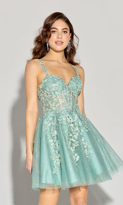 Woman wearing the Short Fit-and-Flare Lace Hoco Dress Eureka EK152, a light teal sleeveless dress with floral embroidery and sheer bodice, standing against a plain light gray background.