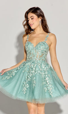 A woman models the Eureka EK152 Short Fit-and-Flare Lace Hoco Dress in light blue-green with floral embroidery and a sheer bodice, standing against a plain background.