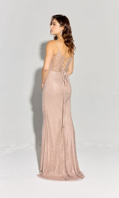 A woman faces away, wearing the Eureka EK161 Lace-Up Long Sheer-Corset Prom Dress in light pink, sleeveless and fitted, with lace-up back detail against a plain light background.