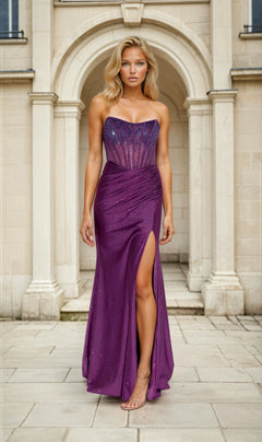 A woman poses against a plain background, wearing the Strapless Beaded Long Prom Dress: Eureka EK169—a strapless purple gown with a sheer corset bodice and high slit, creating an elegant formal look.