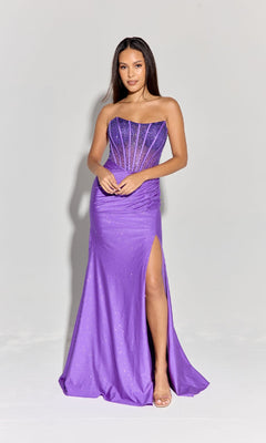 A woman stands against a plain light background in the Strapless Beaded Long Prom Dress: Eureka EK169, featuring a sheer corset bodice, thigh-high slit, and subtle glitter detail that highlights the gown's elegance.