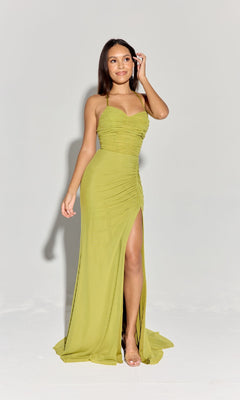 A woman stands against a plain background wearing the Eureka EK187 Spaghetti-Strap Long Formal Dress in light green, featuring a floor-length design with a thigh-high slit and delicate straps.