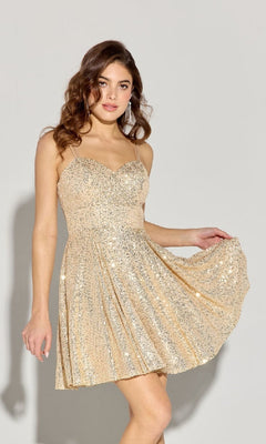 A woman poses against a plain light background wearing the Short Sequin A-Line Hoco Dress: Eureka EK198, featuring gold sequins, strappy open back, and a flared skirt.