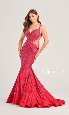 A woman poses in the Sheer-Side Ellie Wilde Designer Prom Dress EW35001, a bright red beaded mermaid gown with side cutouts and a flared hem. "ellie wilde" text appears on the image.