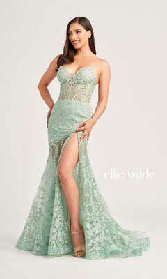 A woman models the Ellie Wilde Long Lace Mermaid Prom Dress EW35005 in light green, featuring a floor-length lace design with a high slit and spaghetti straps, against a plain backdrop. The text "Ellie Wilde" is displayed beside her.