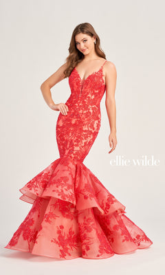 A woman poses in the Ellie Wilde Long Lace Mermaid Prom Dress EW35038, featuring red beaded lace, spaghetti straps, and a tiered ruffle hem. The "ellie wilde" text appears on the right.