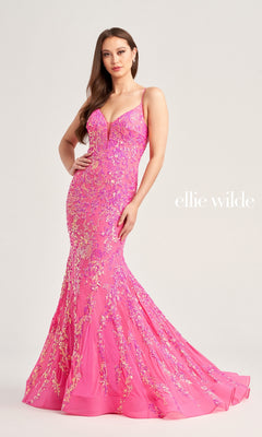 A woman wears the Ellie Wilde Long Mermaid Designer Dress EW35048—fitted, bright pink with sequin floral embellishments—standing against a plain background. "ellie wilde" appears on the right, highlighting this stunning prom dress.
