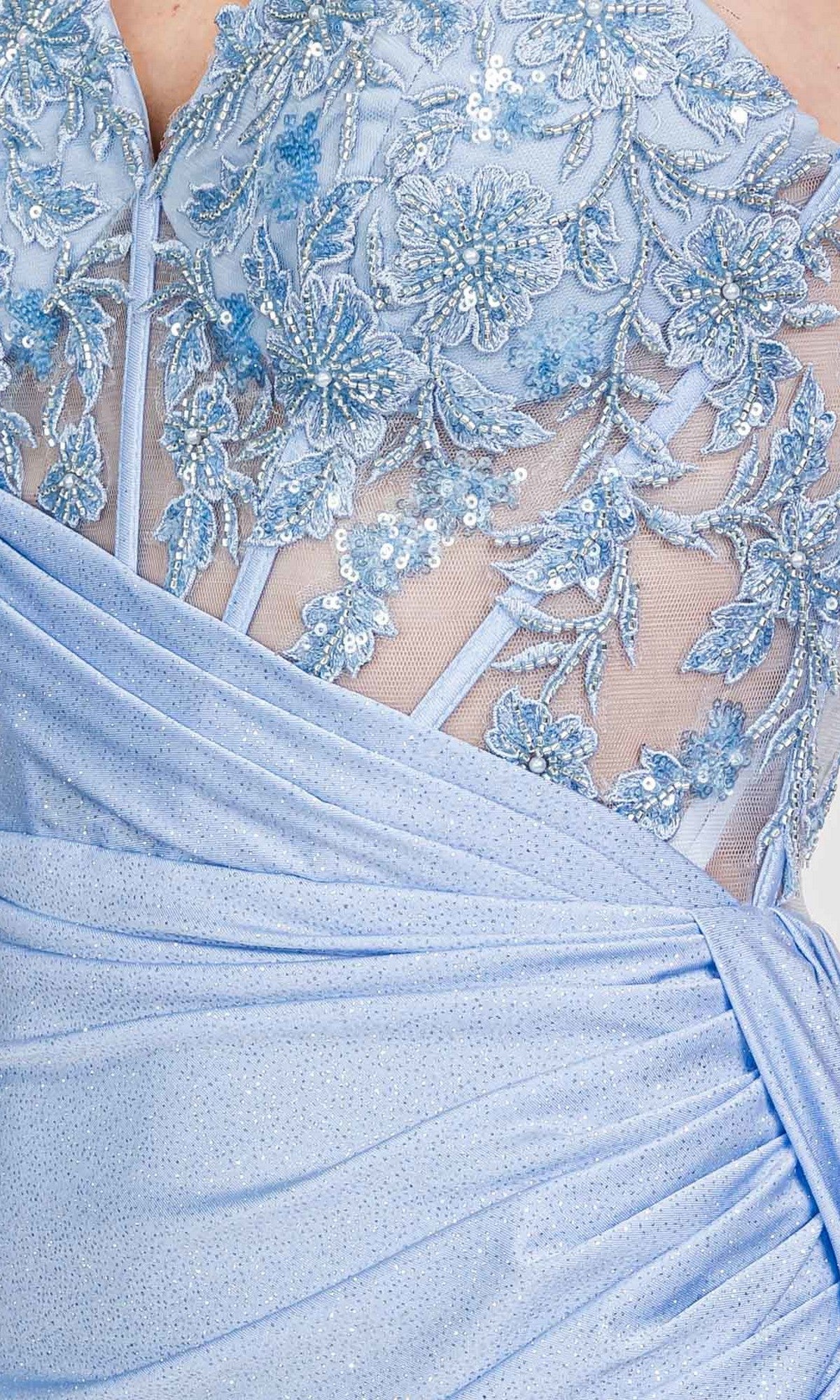 Close-up of the Eureka EK166 long prom dress in light blue, showcasing a sheer-embroidered floral bodice with sequins and glittery fabric draped gracefully at the waist.