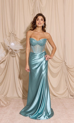 A woman models the Strapless Tight Satin Prom Dress: Eureka EK183—light blue satin with a sequined bodice and sheer side panels—standing before beige draped fabric, creating an elegant look for formal occasions.