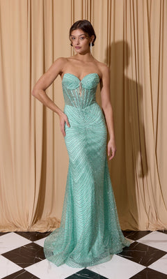 A woman stands before beige curtains on black and white tiles, wearing the Eureka EK195—a mint green, strapless prom dress with a fitted corset bodice, sheer patterned design, and floor-length hem.