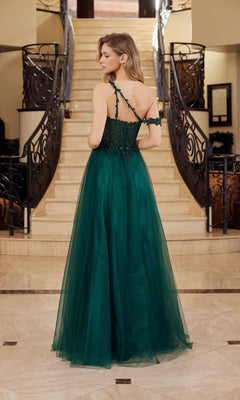 A woman in the Asymmetrical Glitter Prom Dress: Nox Anabel F1567 stands with her back to the camera at the bottom of a staircase with ornate railings.