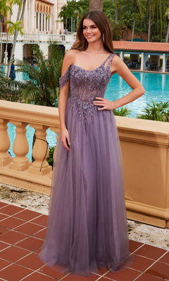 A woman stands poolside wearing the Nox Anabel F1567, an asymmetrical glitter prom dress in lavender with beaded detailing and off-the-shoulder straps.