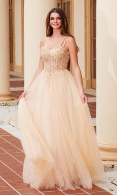 Woman in the Nox Anabel F1567 Asymmetrical Glitter Prom Dress, featuring spaghetti straps and champagne beaded embroidery, stands outdoors on a tiled walkway near cream-colored columns.