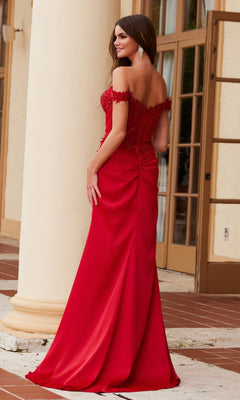 A woman wearing the Beaded-Corset Long Prom Dress: Nox Anabel F1572 in red stands outside by a cream-colored column, facing away from the camera.