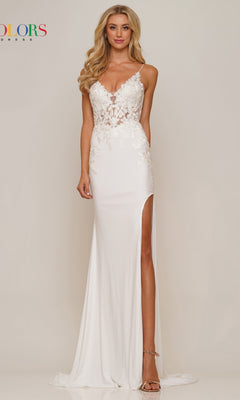 A woman stands against a plain light background wearing the Lace-Up Open-Back Slinky Long Prom Dress G1086, featuring a long white silhouette with lace details, deep neckline, high slit, and open back.