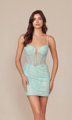 A woman stands against a plain beige background wearing the Sheer-Waist Short Beaded Hoco Dress (Nox Anabel G817), a light blue party dress with sequin embellishments and thin straps.