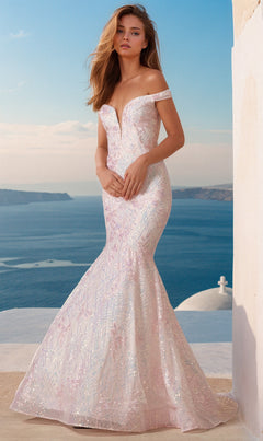 A woman wearing the Off-the-Shoulder Sequin Mermaid Prom Dress 2412 stands on a terrace overlooking the sea and distant hills under a clear sky.