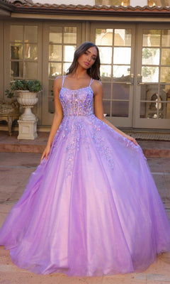 A young woman stands outside, gracefully holding out the skirt of the Glitter-Tulle Long Prom Ball Gown H1271—a lavender ball gown featuring glitter tulle, floral embellishments, and a sheer bodice.