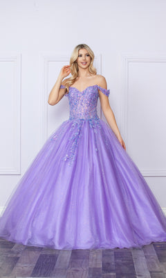 A woman stands indoors in the Bright Off-the-Shoulder Long Prom Ball Gown H1349, a floor-length lavender dress with floral embellishments and a full tulle skirt—perfect for elegant occasions.
