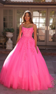 A woman stands outdoors wearing the Embellished Hunter Green Long Prom Ball Gown H1464, featuring a fitted bodice and full skirt adorned with floral accents.