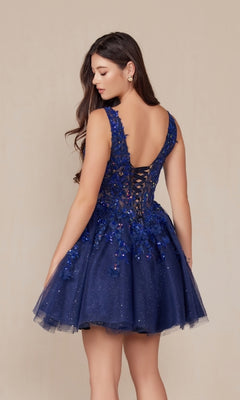 A woman models the Embroidered-Bodice Short A-Line Hoco Dress H846, a sleeveless navy blue party dress with a lace sweetheart bodice, floral appliqué details, and lace-up back, set against a neutral background.