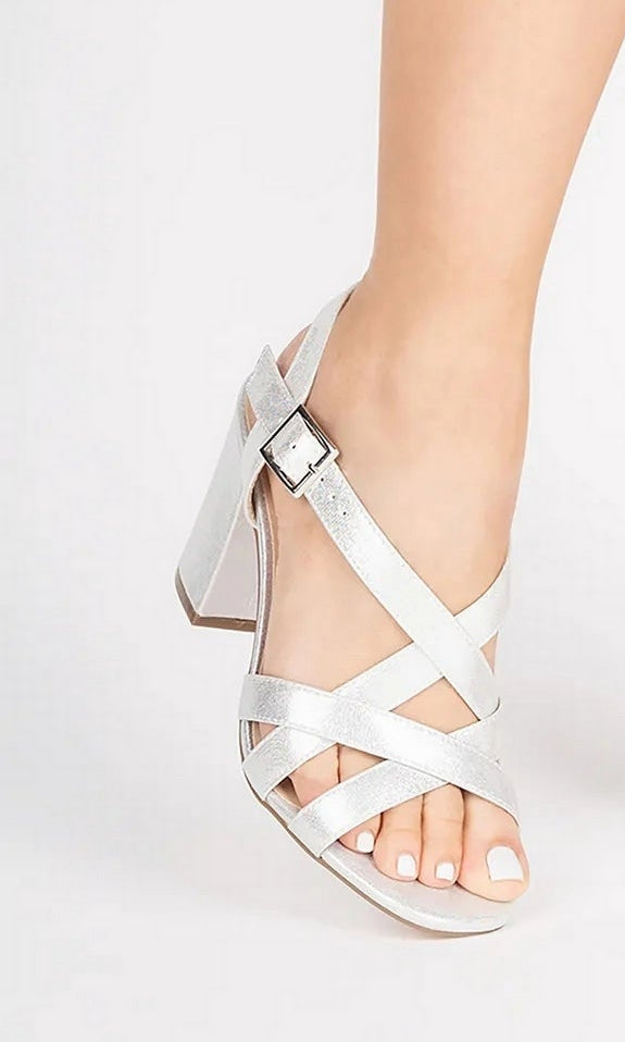 Hilde Silver Prom Shoes: Paradox London P2405 in silver, featuring a block heel, buckled ankle strap, and crisscross front straps worn on a foot.