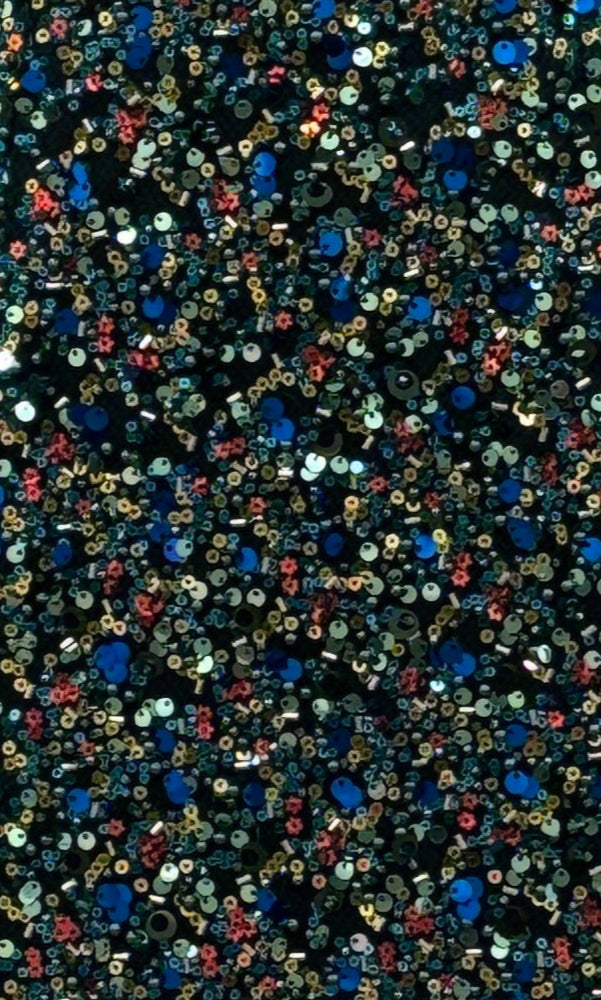 Close-up of densely packed blue, gold, and red sequins on a dark background, reminiscent of the Portia and Scarlett PS25615E Long Prom Dress—perfect for any formal evening event.