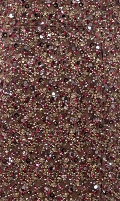 Close-up of the Portia and Scarlett PS25615E Long Prom Dress, featuring a dense layer of pink, gold, and silver sequins for a sparkling, textured look—ideal for formal events.
