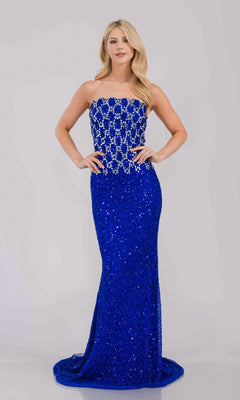 Woman wearing a strapless royal blue evening gown with intricate detailing on a white background