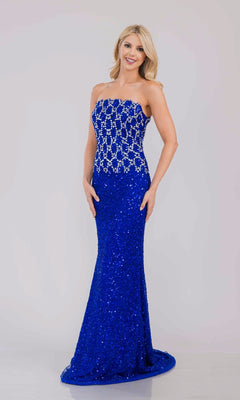 Woman wearing a royal blue strapless evening gown with a beaded patterned bodice on a light gray background