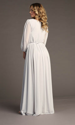 A woman with wavy hair stands with her back to the camera, modeling the Chicas J012B Long-Sleeve Long Formal Dress in light gray, featuring gathered fabric, against a plain background.