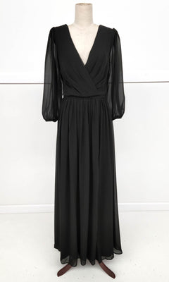 The Long-Sleeve Long Formal Dress: Chicas J012B, featuring a black V-neck wrap-style bodice and sheer sleeves, is displayed on a dress form against a plain white background.