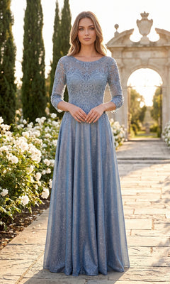 A woman stands on a garden path wearing the Chicas J052 long formal dress in blue—a modest gown with three-quarter sleeves and delicate lace. White flowers and greenery line the walkway, with stone arches in the background.