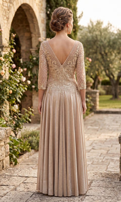 Wearing the Long Formal Dress: Chicas J052 in an elegant, floor-length champagne hue with lace details, a woman stands outdoors on a stone path, facing away.