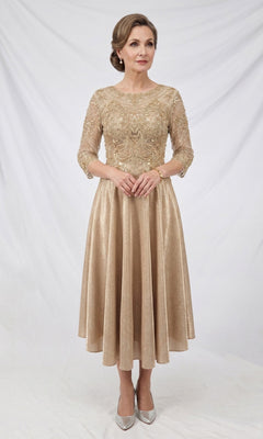 A woman stands against a white backdrop, wearing the Modest Midi Wedding Guest Dress: Chicas J152 in a champagne hue, featuring an A-line silhouette with a lace bodice and three-quarter sleeves. Her light brown hair is styled up and she completes the look with silver high heels, creating an effortlessly elegant ensemble—perfect for wedding guests.