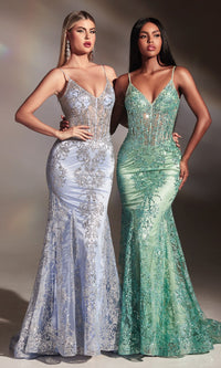 Two women wearing the same dress one in a light blue and the other in a sage green color way, standing in front of a neutral background.