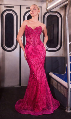 A woman in the Sheer-Sides Strapless Prom Gown: Ladivine J888, bright pink and beaded, stands by the subway door near blue seats.
