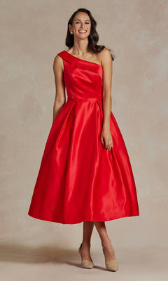A woman wears the One-Shoulder Simple Tea-Length Party Dress JE931 in red with a full skirt and nude heels, posing against a neutral background.