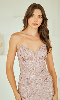 Woman wearing a strapless, sequined evening gown against a neutral background
