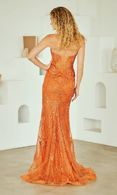 Woman modeling the back of an orange sequin gown in a minimalistic setting