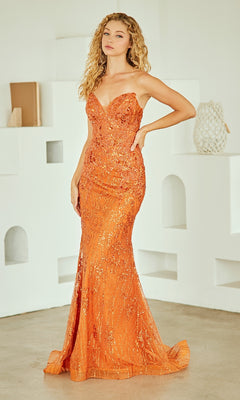Woman wearing an orange sequin evening gown in a minimalistic room.