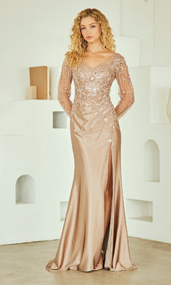Woman wearing a nude colored evening gown with long sleeves in a minimalistic setting.
