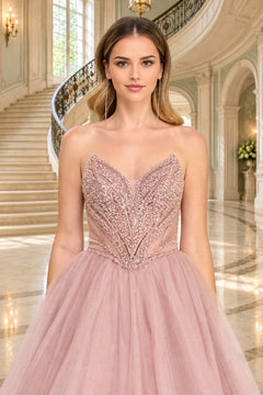 Amelia Couture JQ1104 strapless, dusty rose ball gown with a deep-V corset bodice covered in intricate beadwork and a full, glitter tulle skirt.