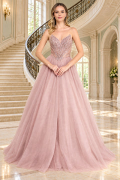 Amelia Couture JQ1104 is a blush-colored strapless prom ball gown featuring a beaded corset bodice and a full, glitter tulle skirt.